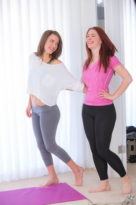 Flexible fitness lesbian girls in yoga pants licking bare ass at the gym