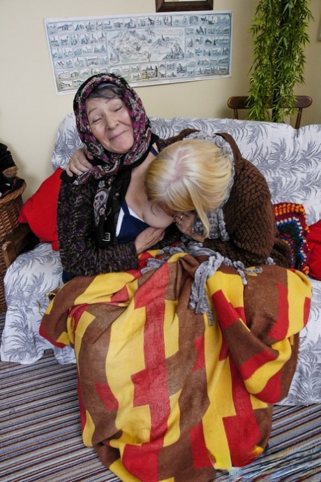 Old lesbians Sofia and Irmchen strip each other and scissor on the sofa